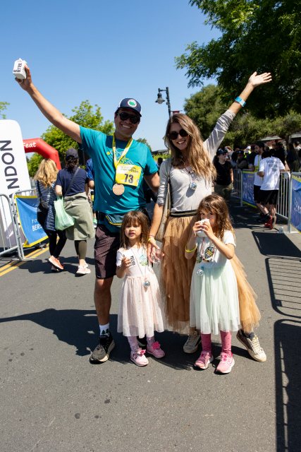 A finisher celebrating with his family